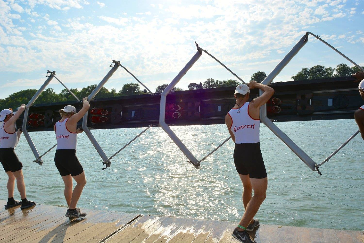 Crescent Boat Club athletes racing at the Royal Canadian Henley Regatta at the end of the Philadelphia rowing season